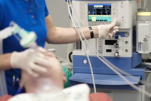 a doctor administering anesthesia to a patient