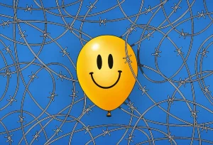 clip art of a smiley-faced balloon surrounded by barbed wire