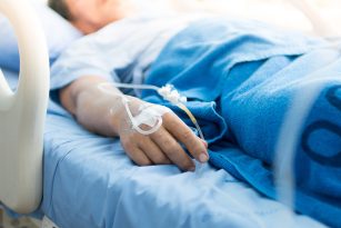 a patient in a hospital bed on an IV