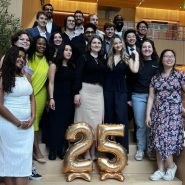 the graduates of TPP 2025 posing on a staircase in front of 25