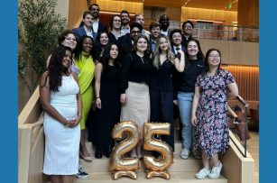 the graduates of TPP 2025 posing on a staircase in front of 25